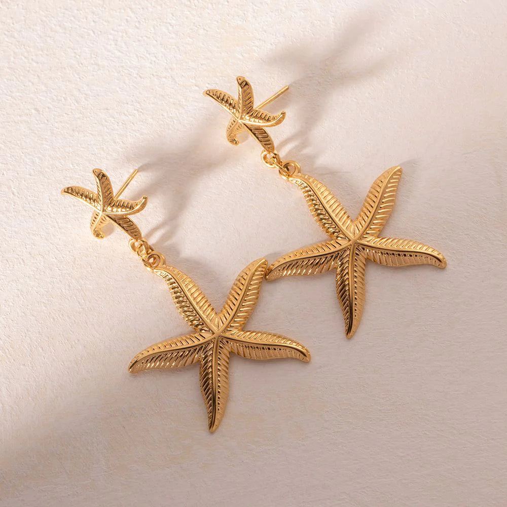 Boucles d'oreilles Dorées pendantes double étoiles de mer