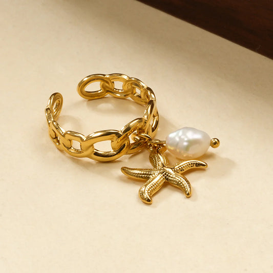Bague maillons pendentifs étoile de mer et perle